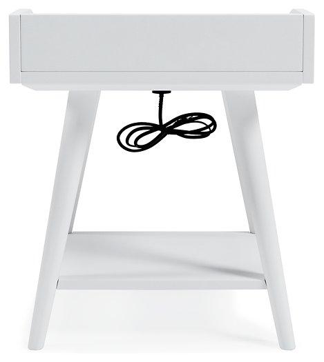 Ashley Furniture Blariden accent table with a wooden top and metal legs, stylish and functional for living room decor.