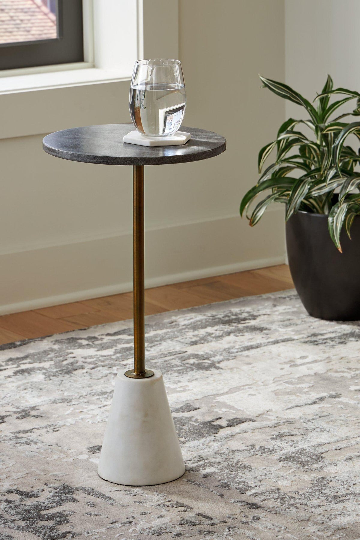 Ashley Furniture Caramont Accent Table with a sleek wooden top and sturdy legs, perfect for living room or bedroom decor.