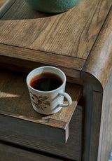 Ashley Furniture Jensworth accent table with wooden top and metal legs, stylish and modern interior decor piece.