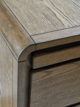Ashley Furniture Jensworth accent table with a sleek wooden finish and modern design, perfect for living room decor.