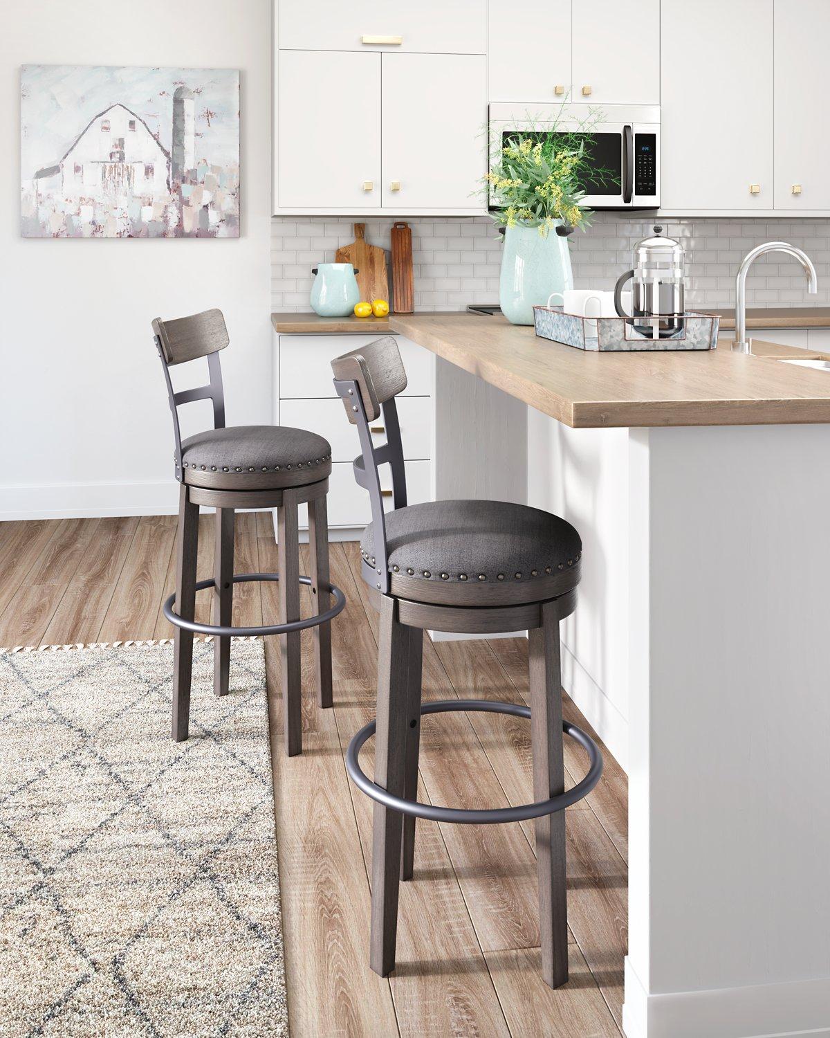 Ashley Furniture Caitbrook bar height bar stool with wooden legs and upholstered seat, perfect for kitchen or bar seating.