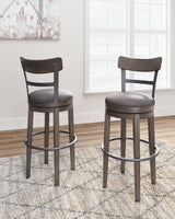 Ashley Furniture Caitbrook bar height bar stool with wooden legs and upholstered seat, shown from a side angle.