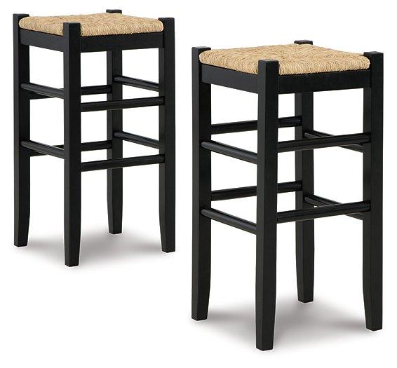 Ashley Furniture Mirimyn bar height barstool with wooden seat and metal frame, shown in a modern kitchen setting