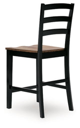 Ashley Furniture Wildenauer counter height barstool with wooden backrest and cushioned seat, ideal for kitchen or bar area.