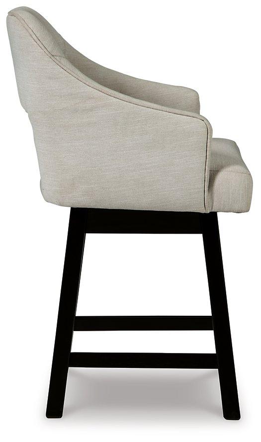 Tallenger counter height bar stool by Ashley Furniture with wooden legs and cushioned seat, ideal for kitchen or bar area.