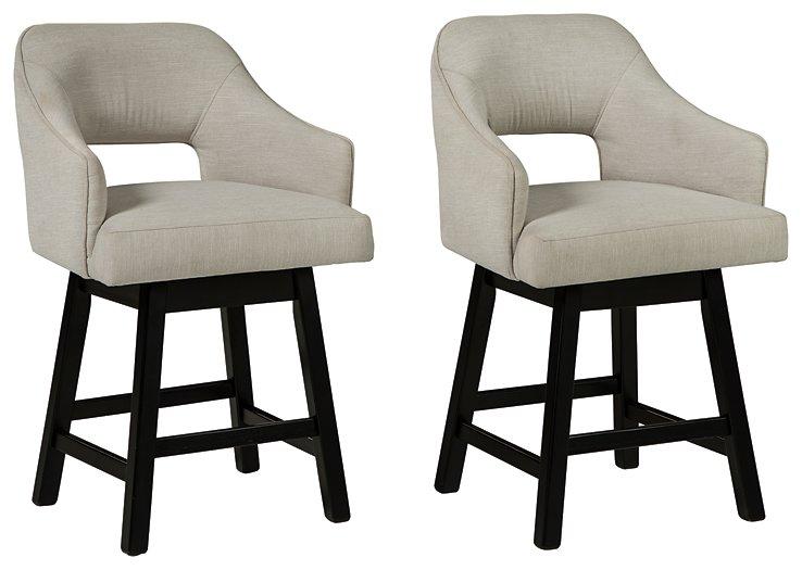Set of Ashley Furniture Tallenger barstools with wooden legs and upholstered seats, ideal for kitchen or bar area.