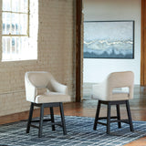 Set of Ashley Furniture Tallenger barstools showing a modern design with wooden legs and cushioned seats.