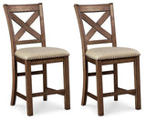 Set of Ashley Furniture Moriville barstools with wooden legs and upholstered seats, perfect for kitchen or bar area.