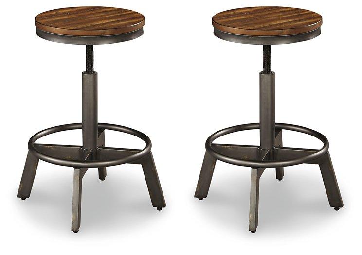 Set of Ashley Furniture Torjin Bar Stools with wooden seats and metal frames, arranged around a kitchen island.