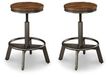 Set of Ashley Furniture Torjin Bar Stools with wooden seats and metal frames, arranged around a kitchen island.