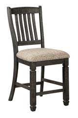 Set of two Ashley Furniture Tyler Creek bar stools with wooden legs and cushioned seats for modern kitchen or bar area.