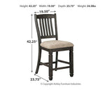 Set of four Ashley Furniture Tyler Creek barstools with wooden seats and metal legs, ideal for kitchen or bar area.