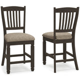 Set of Ashley Furniture Tyler Creek Bar Stools featuring wooden seats and metal legs, arranged around a kitchen island.