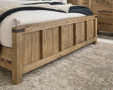 Ashley Furniture Ridgester Bed with detailed wood finish and classic design, showcasing the headboard and frame.