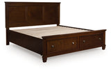 Ashley Furniture Danabrin panel storage bed with a closed storage drawer, dark wood finish, and modern design.