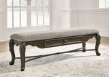 Maylee 63-inch wooden dining bench by Ashley Furniture with a sleek, modern design, perfect for kitchen or dining room seating.