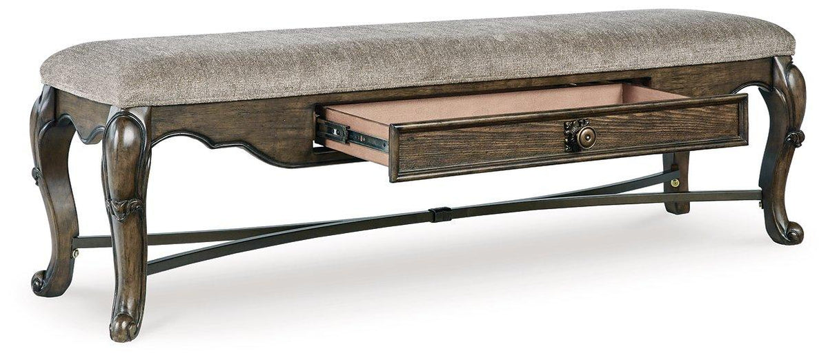Maylee 63-inch wooden dining bench by Ashley Furniture featuring a sleek design and sturdy construction.
