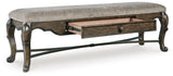 Maylee 63-inch wooden dining bench by Ashley Furniture featuring a sleek design and sturdy construction.