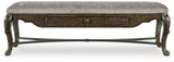 Maylee 63-inch wooden dining bench by Ashley Furniture, showcasing a sleek, sturdy design perfect for kitchen or dining room seating.