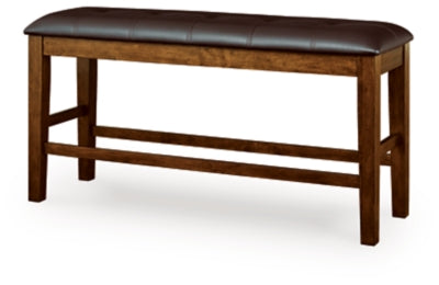 Ashley Furniture Ralene counter height dining bench with wooden legs and upholstered seat, shown from an angled side view.