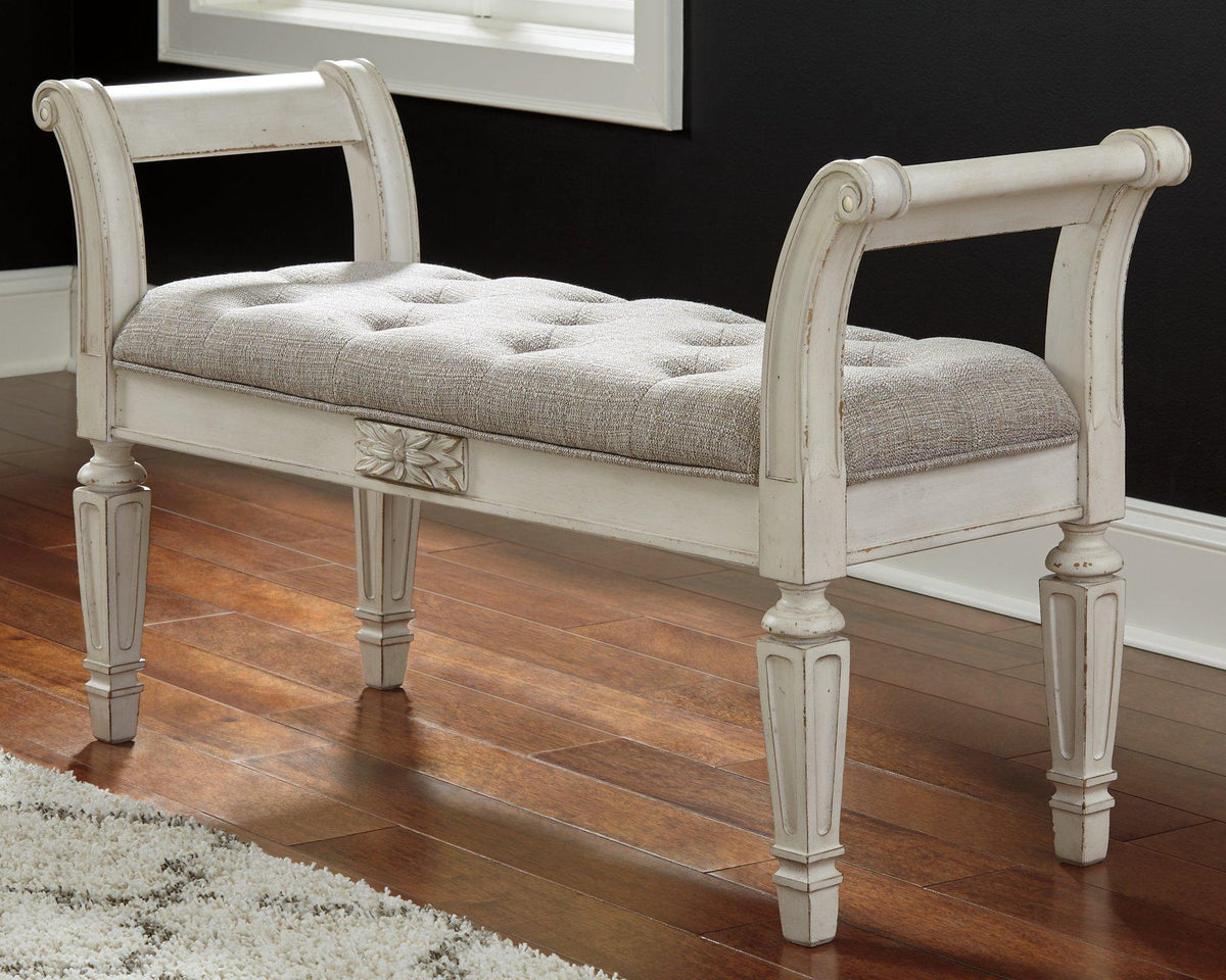 Ashley Furniture Realyn Accent Bench with upholstered seat and wooden legs, ideal for entryways or living rooms.