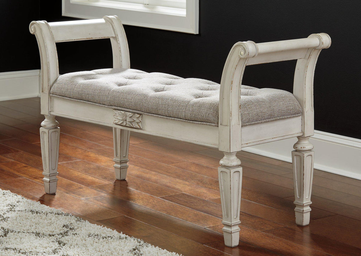 Ashley Furniture Realyn Accent Bench with wooden legs and upholstered seat, ideal for entryways or living spaces.