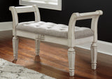 Ashley Furniture Realyn Accent Bench with wooden legs and upholstered seat, ideal for entryways or living spaces.