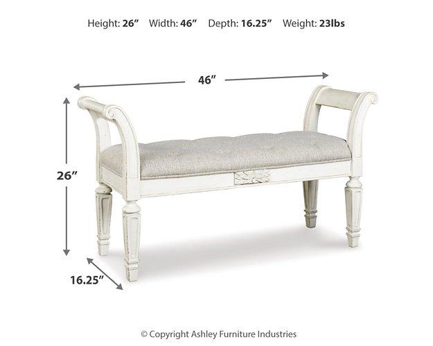 Ashley Furniture Realyn Accent Bench with upholstered seat and wooden legs, ideal for entryway or living room decor.