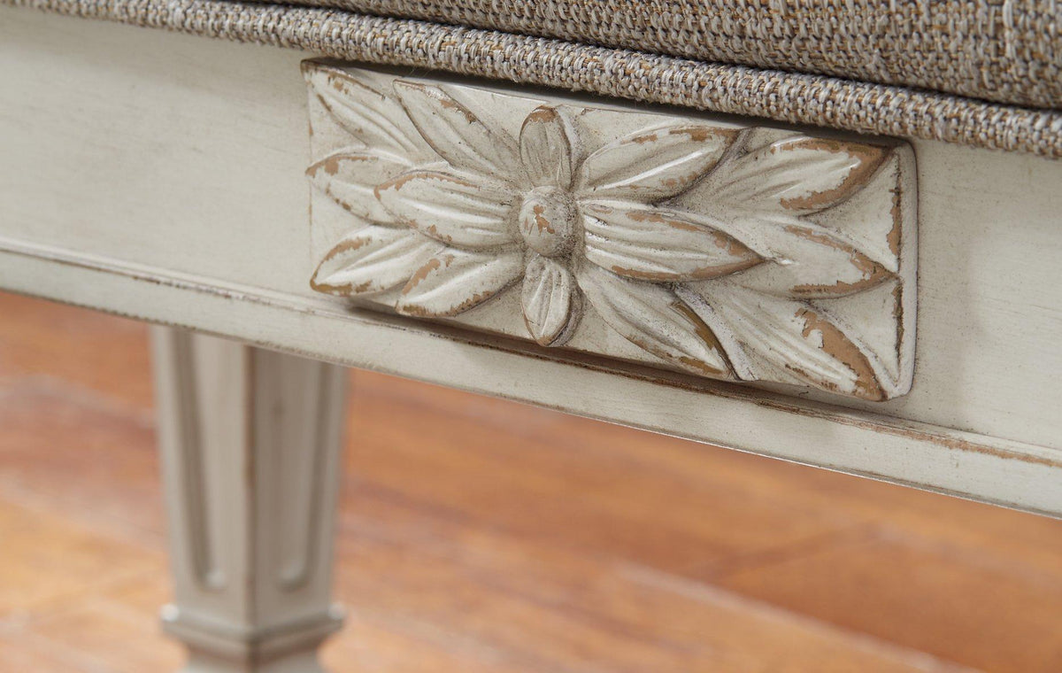 Ashley Furniture Realyn Accent Bench featuring a stylish upholstered seat and wooden legs for versatile home decor.