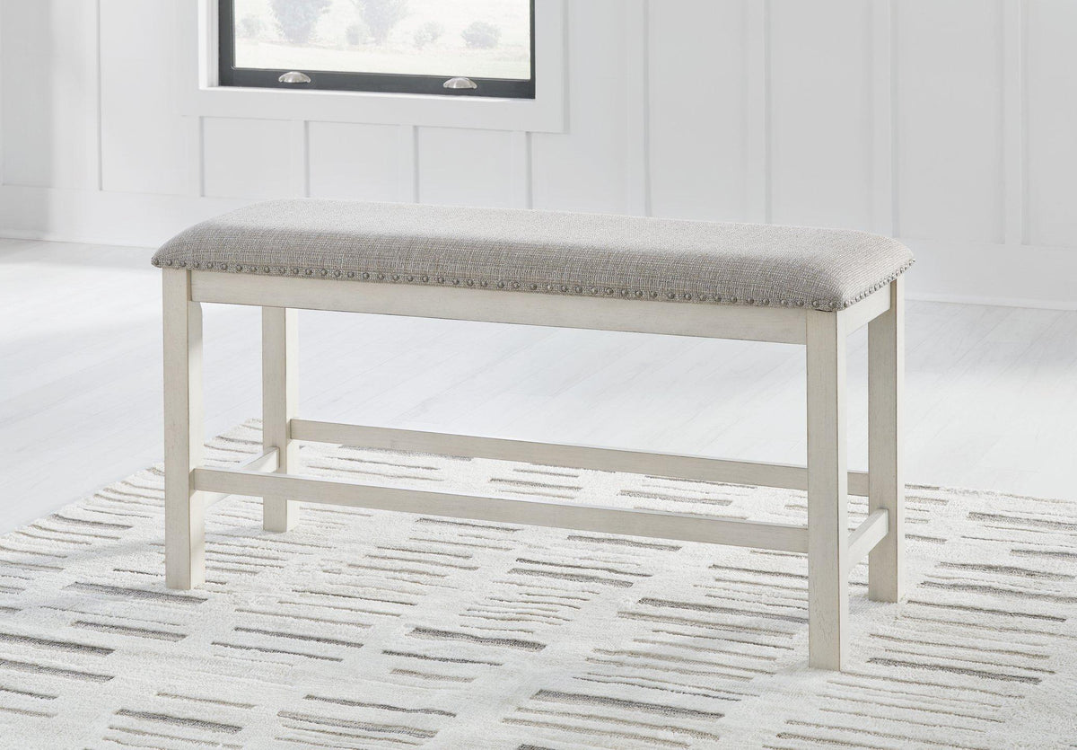 Ashley Robbinsdale 49-inch counter height dining bench with wooden legs and upholstered seat, perfect for modern kitchen or dining room.