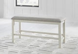 Ashley Robbinsdale 49-inch counter height dining bench with wood finish and upholstered seat for kitchen or dining room use.