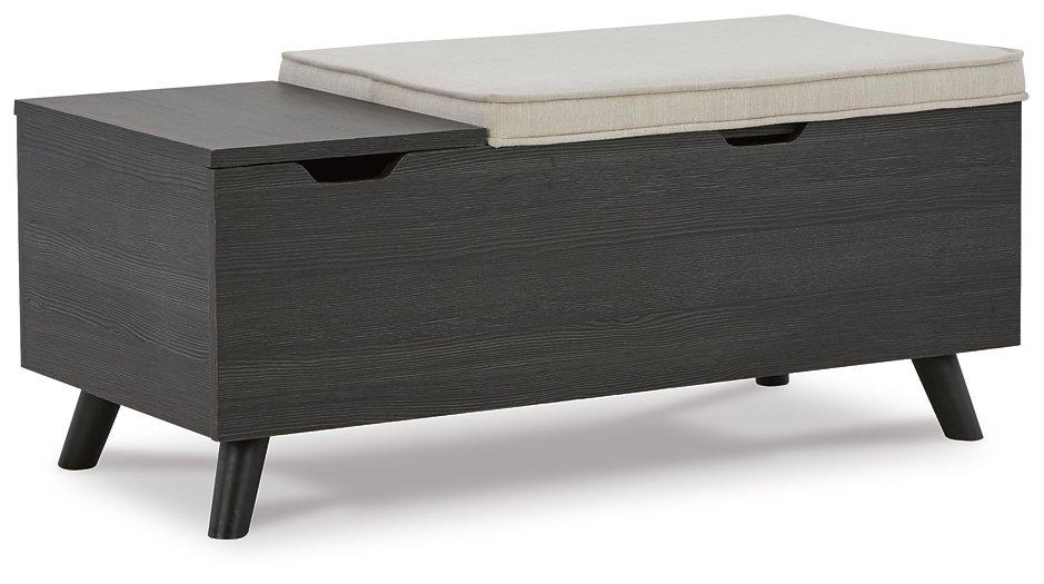 Ashley Furniture Yarlow Storage Bench with cushioned top and wooden legs, ideal for entryway or living room storage and seating.
