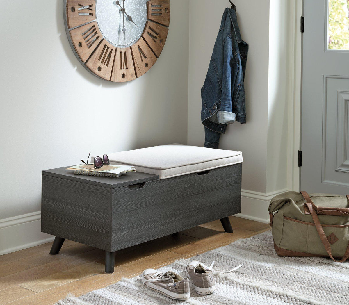 Ashley Furniture Yarlow Storage Bench with cushioned top and wooden base, ideal for entryway or living room storage.