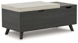Ashley Furniture Yarlow Storage Bench showing a wooden bench with a cushioned top and built-in storage compartment.