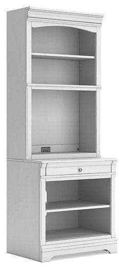 Ashley Furniture Kanwyn Bookcase with open shelves and wood finish, ideal for stylish storage in living or office spaces.