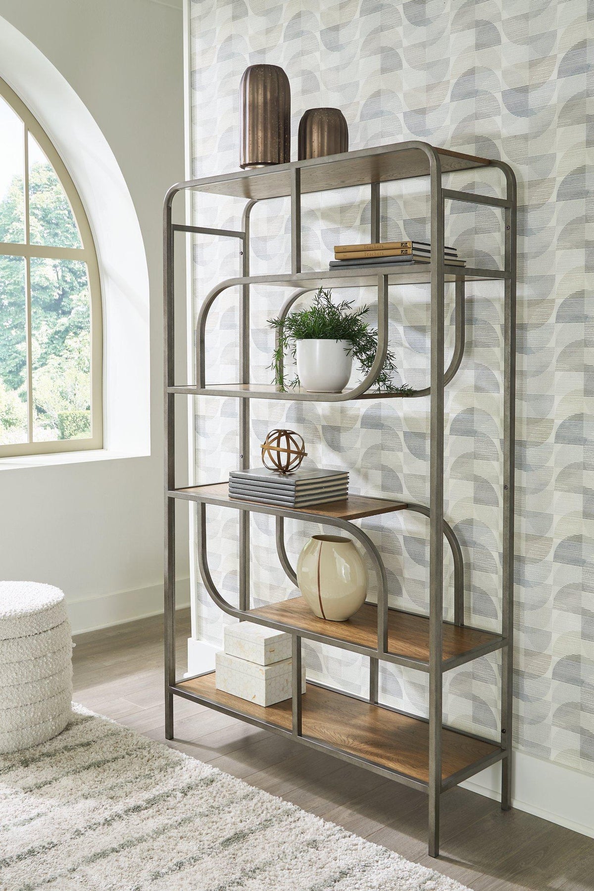 Ashley Furniture Jaddon Bookcase with open shelves and storage compartments in a modern wood finish.