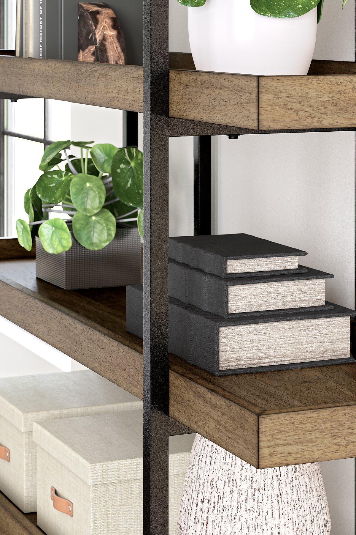 Montia 76-inch wooden bookcase by Ashley Furniture with multiple shelves and open storage for books and decorative items.