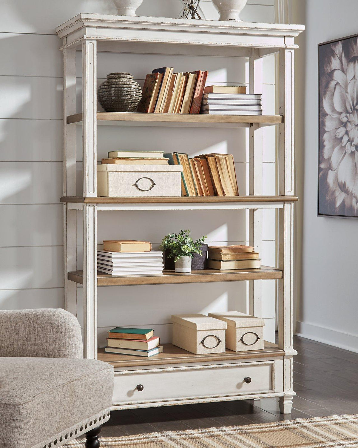 Realyn 75-inch wooden bookcase from Ashley Furniture with multiple shelves and a classic design.