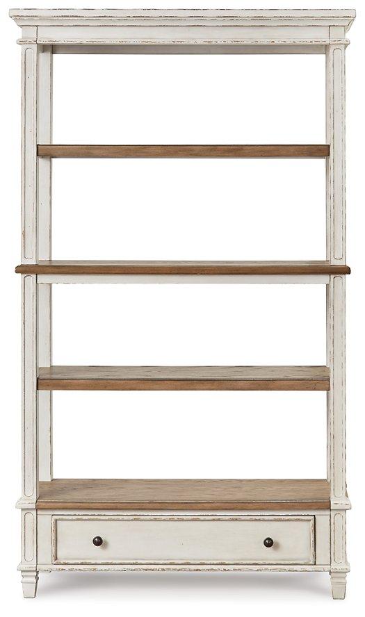 Ashley Furniture Realyn 75-inch bookcase with open shelves and a warm wood finish, ideal for living room or office storage.