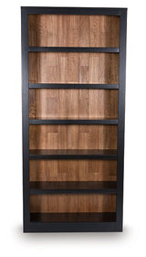 Wildenauer 75-inch wooden bookcase by Ashley Furniture showing tall, spacious shelves and classic design in a natural wood finish.