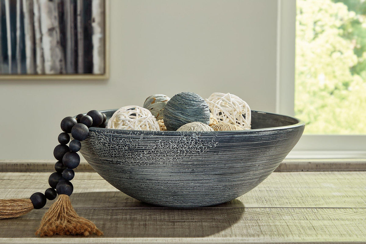 Ashley Furniture Meadie Bowl showing a stylish ceramic bowl with a smooth finish and decorative design.