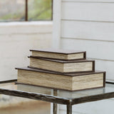 Set of three Ashley Furniture Jolina storage boxes with lid, crafted from wood with a natural finish and sleek design.