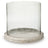 Ashley Furniture Saskia candle holder with a sleek, modern design featuring a metallic finish and a wide base for stability.