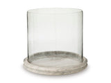 Ashley Furniture Saskia candle holder with a sleek, modern design, featuring a wide base and a tall candle cup.