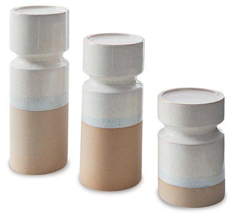 Set of three Ashley Furniture Hurston candle holders with decorative metal design and candle slots, ideal for home decor.