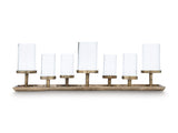 Ashley Furniture Wallmond Candle Holder displayed on a table, showcasing its modern design and sleek finish.