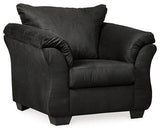 Ashley Furniture Darcy Chair with plush fabric upholstery and wooden legs, showcasing a modern, comfortable seating option.