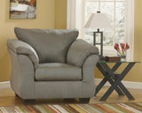 Ashley Furniture Darcy Chair with plush upholstery, wooden legs, and stylish design for comfortable living room seating.
