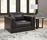 A large Ashley Furniture Amiata Oversized Chair with plush fabric and wide armrests, ideal for comfortable seating in modern living rooms.