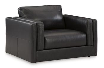 Oversized Ashley Furniture Amiata chair with plush upholstery and wide armrests, perfect for a modern living room.